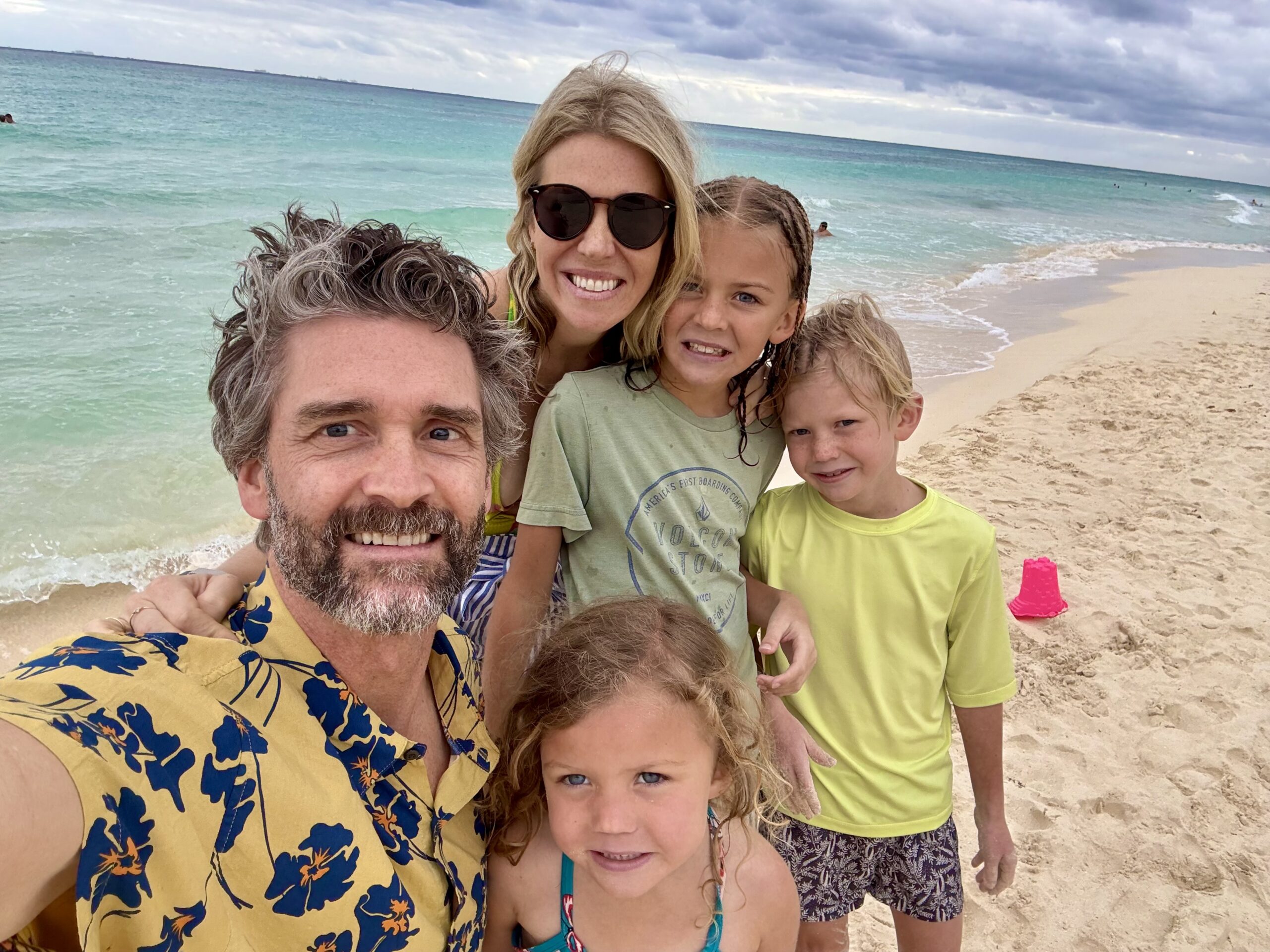 family on the beach in cancun mexico